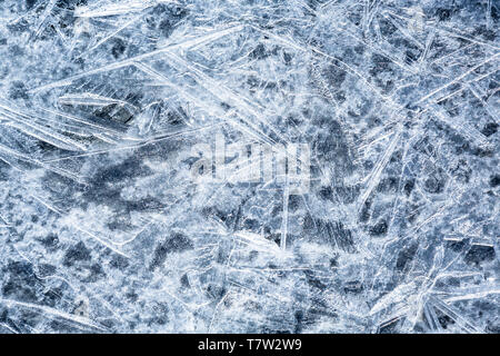 Texture of thin ice on glacier in Alaska. The ice is formed in early spring as the glacier melts then refreezes overnight. Stock Photo