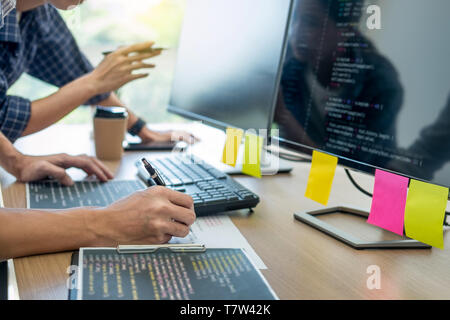 IT office Programmers software development coding technologies On Computer working in a company office. Stock Photo