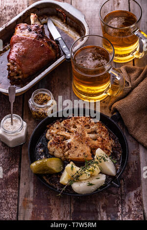 Vegetarian roasted cauliflower steak with potatoes on a frying pan Stock Photo