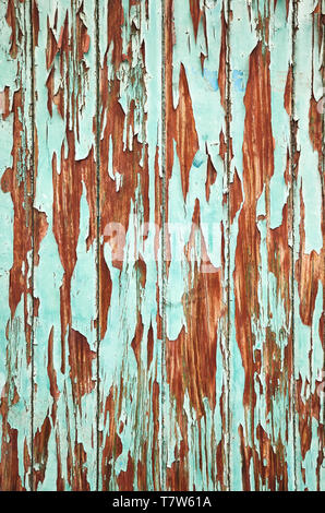 An old wooden wall with peeling paint, background or texture. Stock Photo
