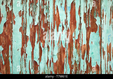 An old wooden wall with peeling paint, background or texture. Stock Photo