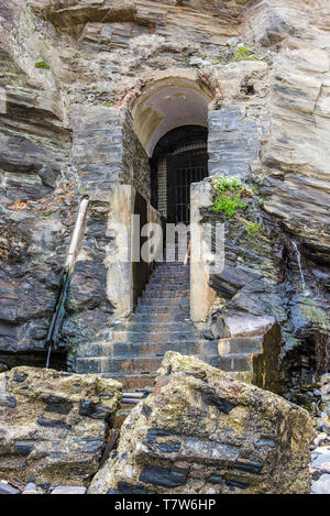 The historic disused entrance to the tunnel leading from Great Western Beach to the Hiotel Victoria in Newquay in Cornwall. Stock Photo