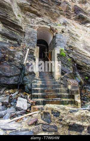 The historic disused entrance to the tunnel leading to a lift shaft from Great Western Beach to the Hotel Victoria in Newquay in Cornwall. Stock Photo