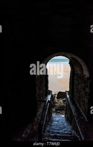 The historic disused exit from the tunnel leading from the Hotel Victoria down to Great Western Beach in Newquay in Cornwall. Stock Photo