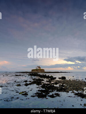Porth Cwyfan, UK - May 3, 2019: 'The Church in the Sea' (eglwys bach y mor) at Port Cwyfan. Stock Photo