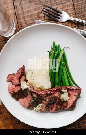 8oz Prime Bavette with green beans and mashed potatoes Stock Photo