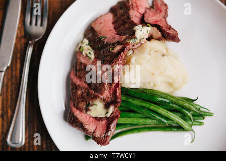8oz Prime Bavette with green beans and mashed potatoes Stock Photo