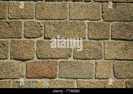 Close-up of old wall made of large stone bricks, forming a charming background at Monsanto. A cute and peculiar historic village of Portugal. Stock Photo