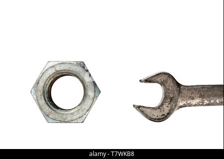 Large hex nut and wrench on white background. Stock Photo