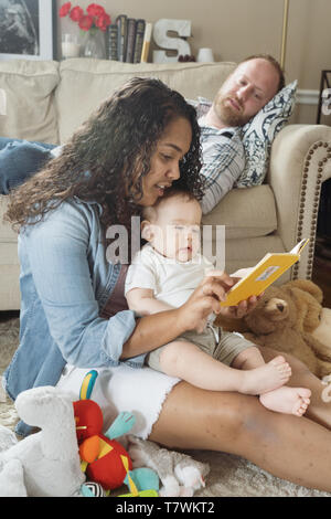 family of  4 in north Philadelphia, 6 month old baby, 15 year old sister. Stock Photo