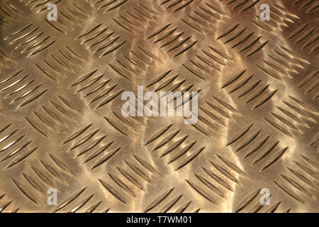 Beautiful close-up of aluminium sheet industrial design used as  background for merchandising decoration of purses and bags in a fashion store. Stock Photo