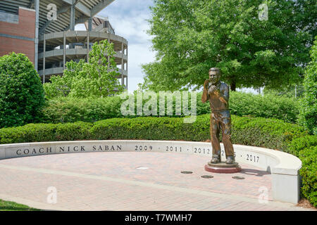 Bronze statue of University of Alabama football coach Nick Saban along the Walk of Champions at Bryant-Denny Stadium, in Tuscaloosa Alabama, USA.