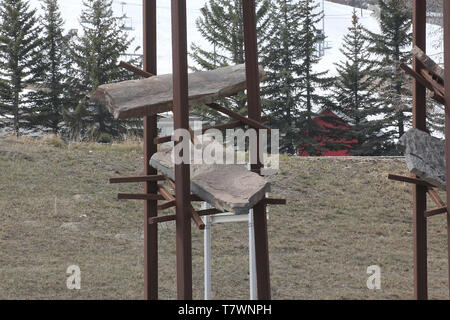 Bowfort Towers are four “sentinels”  steel beams which are intended to look rusty. Each sentinel cradles Rundle rock, a type of stone found in Alberta. Stock Photo