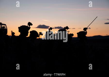 U.S. Soldiers serving with 1st Battalion, 17th Infantry Regiment, 2nd Brigade, 2nd Infantry Division, 2nd Stryker Brigade Combat Team, Fort Lewis, Wash., prepare to practice an air assault mission in support of Joint Warfighting Assessment 19, at Yakima Training Center, Wash., May 5, 2019. JWA’s mission is to assess Multi-Domain Operations (MDO) Concepts, Capabilities, and Formations at echelon in order to provide critical insights and feedback on Army Modernization efforts towards an MDO Capable Force by 2028 in partnership with USARPAC, I Corps, Joint, Allied/Multi National Partners, and Fut Stock Photo