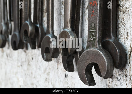 Spanners hanging on the wall in the workshops of the engine sheds at Minehead station on the West Somerset Railway. Stock Photo