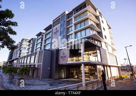 Cape Town, South Africa, 12th April - 2019: Luxury apartment building along waterfront canal Stock Photo