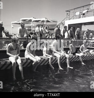 1960s, historical, in the middle of the ocean, out on deck of the ...