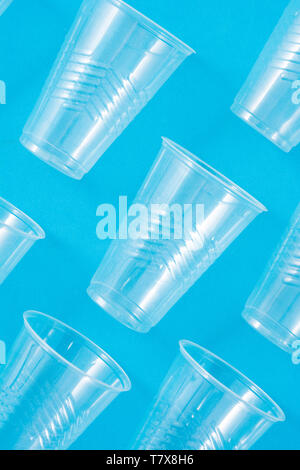 Disposable waste plastic cups pattern  on blue background Stock Photo