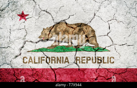 State of California flag, state in the Pacific Region of the United States, on dry earth ground texture background Stock Photo