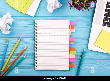 Planner on the wooden working table with computer. Blank white paper on working desk Stock Photo