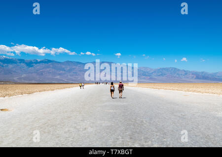 Landscape, Badwater Basin, Death Valley National Park, California, USA. Tourists walking on the salt crust *** Local Caption *** Stock Photo