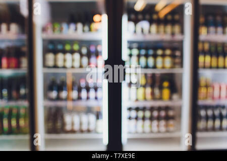Background Blurred Defocused Beers are cooling in fridge, freezer or refrigerator shelf. Defocused Blurry Night life, Night Club, Bar, Pub, Store or G Stock Photo