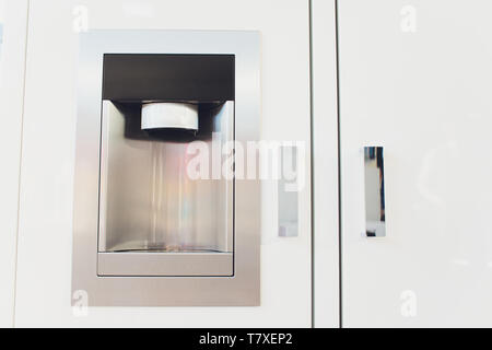 Refrigerator Ice and Water Dispenser modern front design close-up Stock Photo