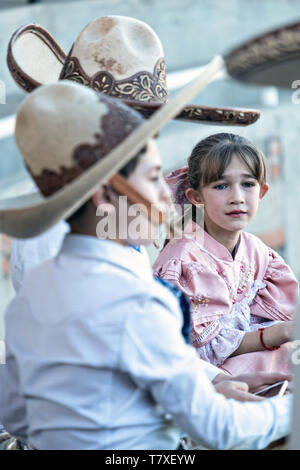 Analia Franco de Anda, right, and her cousin Luis Alfonso Franco Jimenez at the family Charreria practice session in the Jalisco Highlands town of Capilla de Guadalupe, Mexico. The Franco family has dominated Mexican rodeo for 40-years and has won three national championships, five second places and five third places. Stock Photo