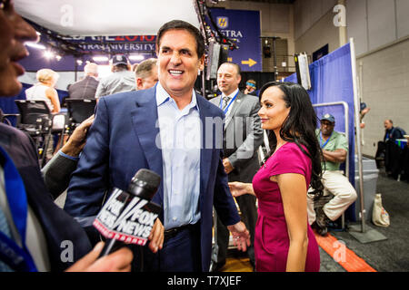 Billionaire and anti-Trump Mark Cuban is confronted by Trump spokeswoman Katrina Pierson after being interviewed by Fox News. The Democrate and Republican nominees for US President, Hillary Rodham Clinton and Donald John Trump, met on Sep. 26th for the first head to head Presidential Debate at the Hofstra University in Long Island. Stock Photo