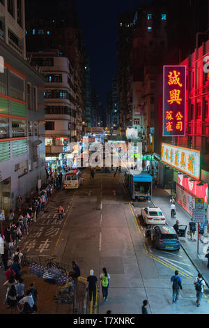 Night view of a bus stop in Mong Kok in Hong Kong, China. Stock Photo