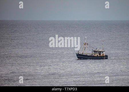 a black cutter fishing in the North Sea Stock Photo