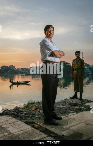 One meter of se level rise will put twenty percent of our country under water, says climate scientist Mozaharul Alam. Here he is next to the all encompassing water in the capital city Dhaka. Bangladesh is prone to a double whammy of flooding and drought caused by the melting glaciers of Himalaya. Stock Photo