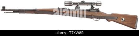 A scope rifle 98 k, Mauser, with high top-hinged mount and scope Dialytan, cal. 8 x 57, no. 42064d. Matching numbers. Mirror-like bore. Code on receiver head covered by front mount base, but various acceptance marks eagle/'135'. According to serial number manufactured after 1944 at Mauser-Werke AG, Oberndorf. Sheet steel-stamped magazine plate. Original finish, partially thin and somewhat spotted. Dark laminated stock without external number, not taken apart. Complete with strapping, pitted cleaning rod and front sight guard. Mounted with high to, Additional-Rights-Clearance-Info-Not-Available Stock Photo