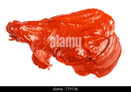 stain of red-orange oil paint on a white Stock Photo
