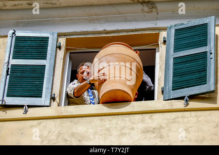 Corfu, Greece - April 27, 2019: Corfians throw clay pots from windows and balconies on Holy Saturday to celebrate the Resurrection of Christ Stock Photo