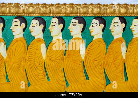 Monk pattern on the stucco wall of the Thai church.(Public area not required Property Release) Stock Photo