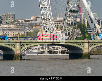 London Bus on Westminster Bridge over the River Thames, London,  London Eye in background Stock Photo