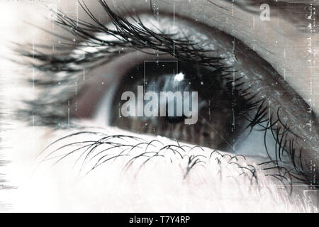 Female eye with pupil and eyelashes close-up with overlay of technological futuristic elements of artificial intelligence. Stock Photo
