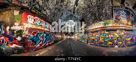 The Banksy Tunnel, ( Leake St Tunnel or Leake Street Arches ) legal Graffiti venue under Waterloo train station, London, UK. Stock Photo