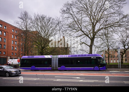 A Translink Glider bendy bus in the centre of Belfast, Northern Ireland Stock Photo