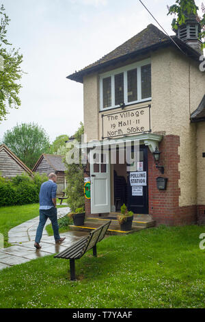 A man goes to cast his vote in the Polling Station in North Stoke Village Hall, Oxfordshire. Stock Photo