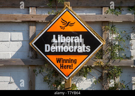 An orange and black election poster for the Liberal Democrats in the local elections reading 'Winning Here'. Stock Photo