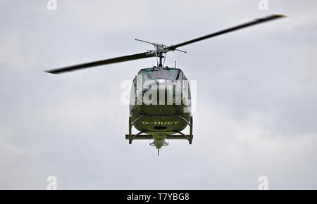 Bell UH-1 Iroquois 'Huey' flying at the season premiere at Shuttleworth on the 5 May 2019 Stock Photo