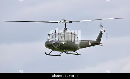 Bell UH-1 Iroquois 'Huey' flying at the season premiere at Shuttleworth on the 5 May 2019 Stock Photo