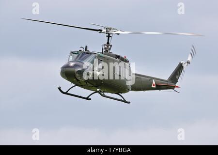 Bell UH-1 Iroquois 'Huey' flying at the season premiere at Shuttleworth on the 5 May 2019 Stock Photo