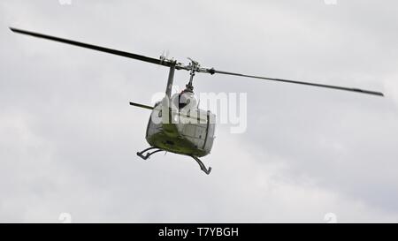 Bell UH-1 Iroquois 'Huey' flying at the season premiere at Shuttleworth on the 5 May 2019 Stock Photo