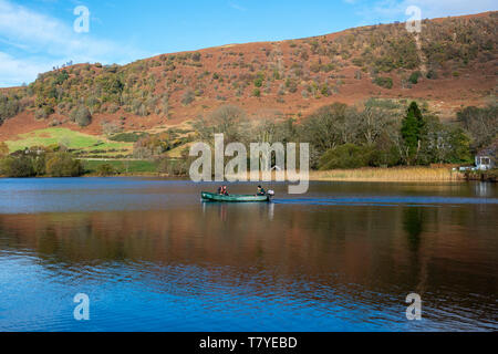 Fishermen setting off across Lake of Menteith in the Trossachs, Scotland, UK Stock Photo