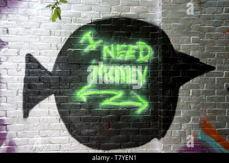 Hackney Wick. Writing on the wall , 'I need money', next to the canal. Stock Photo