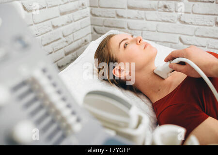 Doctor Examining The Thyroid Gland Of A Female Patient Stock Photo - Alamy