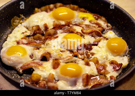 Huge size Bacon and eggs as English breakfast in a pan Stock Photo